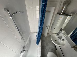 a bathroom with a shower and a toilet and a sink at Comfort Apartments Heilbronn in Heilbronn