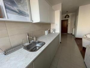 a kitchen with a sink and a counter top at Mieszkanie Stare Miasto Gdańsk in Gdańsk