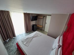 Postel nebo postele na pokoji v ubytování Hotel Alion21