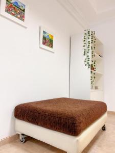 Llit o llits en una habitació de BORGES HOUSE APARTS Apartamentos con cochera a dos cuadras del Obelisco!