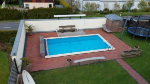 an overhead view of a swimming pool in a yard at FeWo Mogendorf in Mogendorf