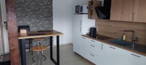 a kitchen with a counter and a sink and a stove at FeWo Mogendorf in Mogendorf