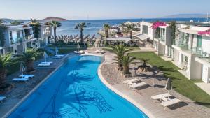 an overhead view of a swimming pool at a resort at Lugga Boutique Hotel & Beach in Ortakent