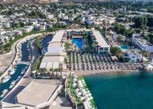 an aerial view of a resort with a marina at Lugga Boutique Hotel & Beach in Ortakent