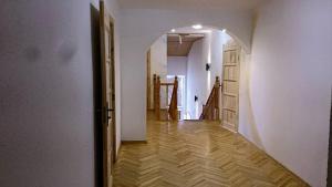an empty room with a hallway with an open door at Travel home in Riga