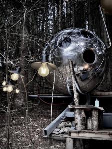 a weird looking object sitting on top of train tracks at Mirror globe Kandasphere in Saint-Gervais-les-Bains