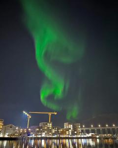 an image of a green light in the sky at The Seaview Suite - Tromsø harbour! in Tromsø