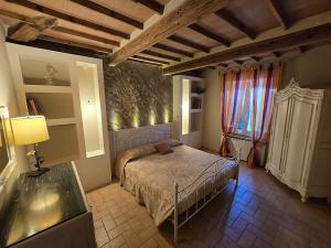 Postel nebo postele na pokoji v ubytování Gli Ulivi di Siena 2 + 7 fotografií