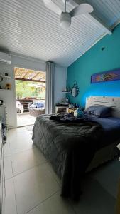 Ένα ή περισσότερα κρεβάτια σε δωμάτιο στο Casa Aconchego - Arraial D Ajuda- Bahia