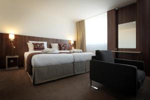 Posteľ alebo postele v izbe v ubytovaní Hotel Metropol