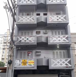 a tall building with balconies on the side of it at Aluguel de apartamento in São Leopoldo