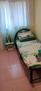 Postel nebo postele na pokoji v ubytování 3J's Place