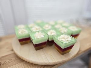 a group of green and brownies on a wooden plate at Willa Anavill in Mielno