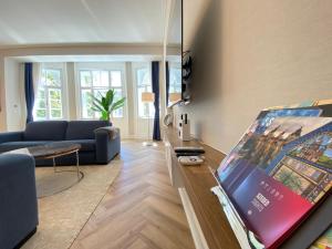 Televízia a/alebo spoločenská miestnosť v ubytovaní Five Stars Experience Bestern