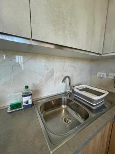 A kitchen or kitchenette at OpenView Apartment Marsaxlokk
