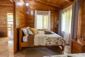 Postel nebo postele na pokoji v ubytování Esquipulas Rainforest