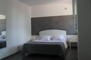 Postel nebo postele na pokoji v ubytování Monnalisa Village