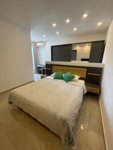 A bed or beds in a room at OpenView Apartment Marsaxlokk