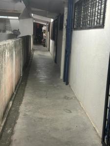 an empty hallway of a building with a long alley at Jaquar Living in Kuala Lumpur
