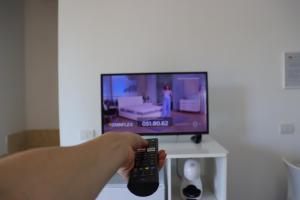 TV a/nebo společenská místnost v ubytování Monnalisa Village