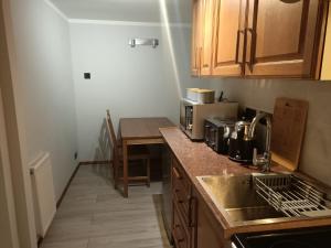 a kitchen with a sink and a counter top at Cottage in Snowdonia in Blaenau-Ffestiniog
