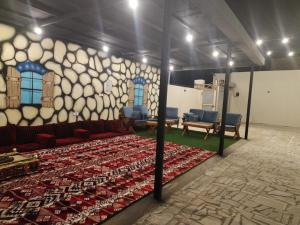 Postel nebo postele na pokoji v ubytování شالية نخلة + 4 fotografie