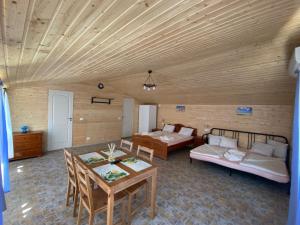 a living room with a couch and a table at Pensiunea Blue House in Vadu