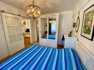 a large room with a blue and white carpet at Old Town Apartment in Constanţa