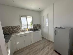 Kuchyň nebo kuchyňský kout v ubytování Penthouse Sousse