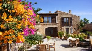 a house with flowers in front of it at Sa Carrotja - Adults Only in Ses Salines