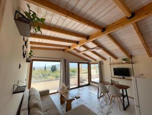 a living room with a couch and a table at Serenity in Samos