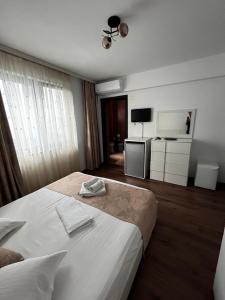 Postel nebo postele na pokoji v ubytování Elegance