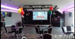 a room with a stage with balloons and tables and chairs at Caravan - 3 Bedrooms, Sleeps 8 in Rhyl