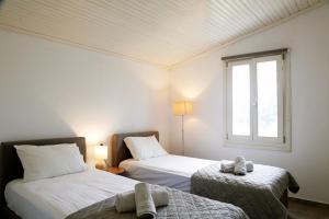 A bed or beds in a room at ELAION GAIA