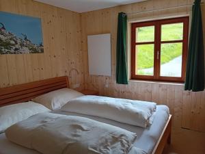 Posteľ alebo postele v izbe v ubytovaní Pfefferhütte