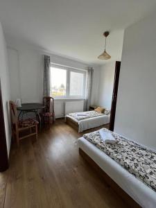 Postel nebo postele na pokoji v ubytování Gościnna 10