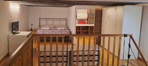 a bedroom with a bed and a stairway to a room at World movida in Sanremo