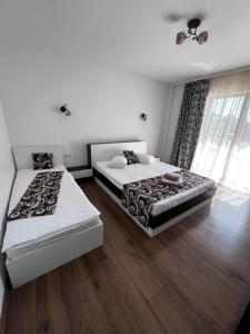 Postel nebo postele na pokoji v ubytování Elegance