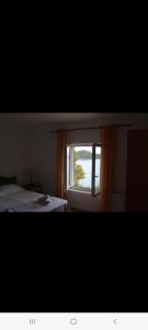 Postel nebo postele na pokoji v ubytování Apartmani Marija Mljet