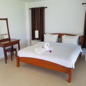 Postel nebo postele na pokoji v ubytování Sunrise Beach Resort