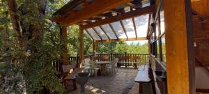 a wooden pavilion with tables and chairs on a patio at PROF OLIVETO ANTICo in San Marco in Lamis