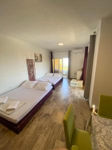 Postel nebo postele na pokoji v ubytování Apartments Bibic