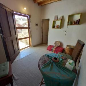 a room with a room with a table and a window at Special cozy studio assala in Dahab