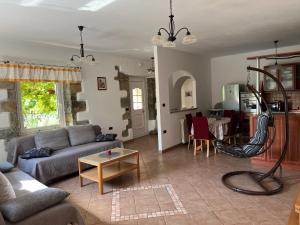 a living room with a couch and a table at Apartment Villa Istriana in Koper