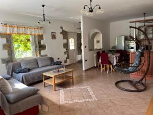 a living room with a couch and a table at Apartment Villa Istriana in Koper
