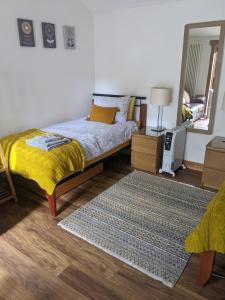 Postel nebo postele na pokoji v ubytování Sunnyside Annexe