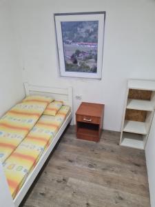 Postel nebo postele na pokoji v ubytování Masovic rooms - bikers friendly