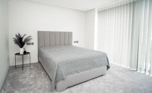 En eller flere senge i et værelse på MARVEL apartamentai