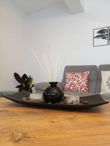 a tray with a vase on top of a table at Seaside Breeze Apartment in Sitia