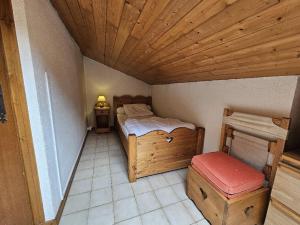 Ένα ή περισσότερα κρεβάτια σε δωμάτιο στο Appartement centre Village Grand Bornand